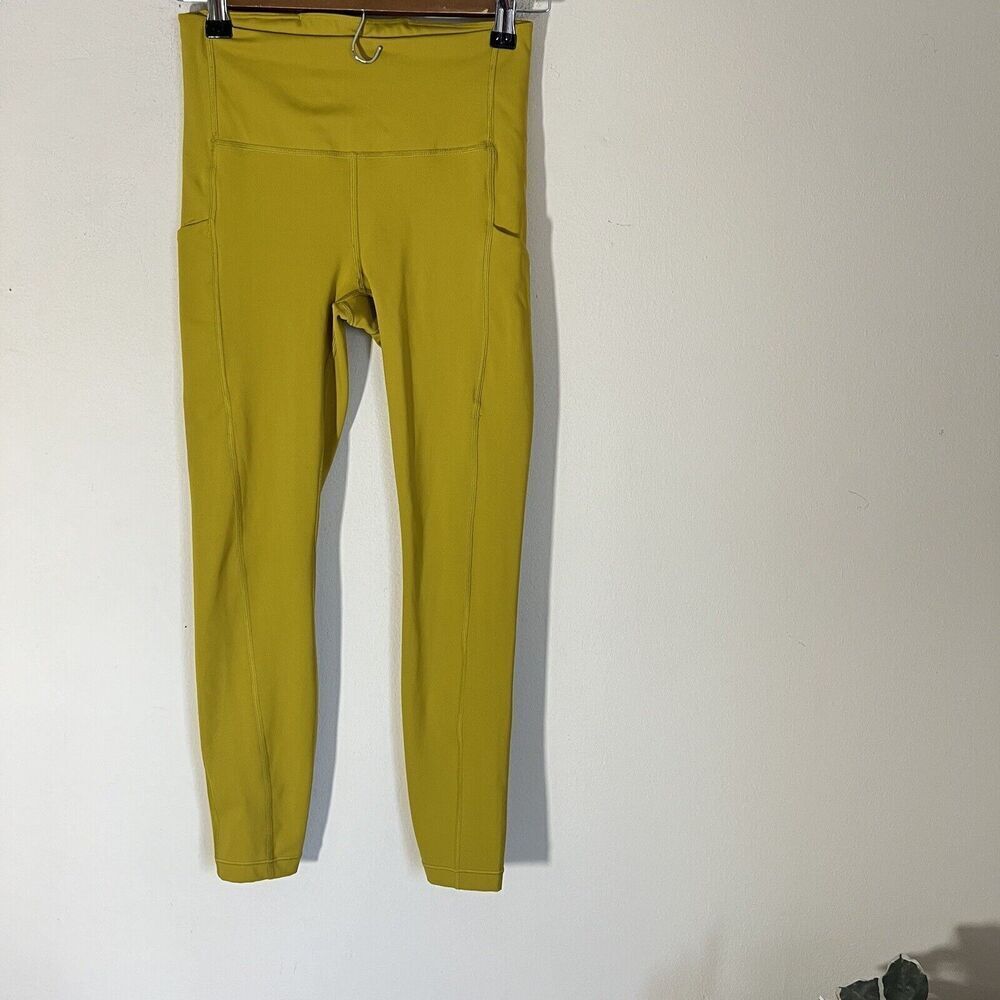 ATHLETA Ultimate Stash Pocket 7/8 Tight Mustard Yellow Legging Size XS